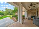 Inviting covered patio with comfortable seating, perfect for outdoor relaxation at 390 Glengarry Chase, Covington, GA 30014
