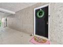 Unit entrance features a decorative wreath, welcome mat and fresh neutral paint at 3115 Seven Pines Ct # 308, Atlanta, GA 30339