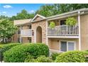 Inviting condo building featuring private patios and lush landscaping at 3115 Seven Pines Ct # 308, Atlanta, GA 30339