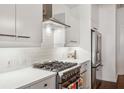 Clean kitchen featuring white cabinets, stainless steel appliances, and gas range at 805 Peachtree Ne St # 411, Atlanta, GA 30308
