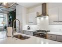 Modern kitchen with white cabinets, subway tile backsplash, and stainless steel appliances at 805 Peachtree Ne St # 411, Atlanta, GA 30308