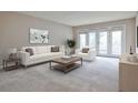 Bright living room with stylish furniture and glass doors offering seamless indoor-outdoor living at 3650 Ashford Dunwoody Ne Rd # 514, Atlanta, GA 30319