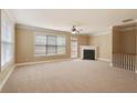 Inviting living room with a fireplace and a walkout to the deck at 5060 Windcrest Lane, Alpharetta, GA 30022
