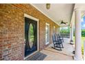 Spacious front porch with classic rocking chairs and a swing, perfect for relaxing outdoors at 705 S Bethany Rd, Mcdonough, GA 30252