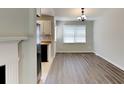 Dining room boasts hardwood floors and great natural light adjacent to the kitchen at 365 Wesley Mill Pl, Villa Rica, GA 30180