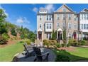Beautiful townhome with a landscaped yard and outdoor seating area, perfect for relaxing and entertaining guests at 621 Hanlon Way, Alpharetta, GA 30009