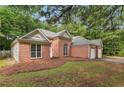 Charming brick home featuring a two-car garage and traditional design at 288 Old Burnt Hickory Rd, Acworth, GA 30101