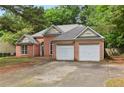 Charming brick home featuring a two-car garage and traditional design at 288 Old Burnt Hickory Rd, Acworth, GA 30101