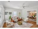 Bright living room featuring hardwood floors, large windows, and contemporary furnishings at 1633 Woodbine Ne Ave, Atlanta, GA 30317