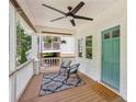 Inviting front porch with seating, ceiling fan, and stylish decor creating a welcoming entrance at 1633 Woodbine Ne Ave, Atlanta, GA 30317