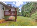 Spacious backyard with a wooden deck, perfect for outdoor gatherings and entertaining at 1900 Tribble Ridge Dr, Lawrenceville, GA 30045