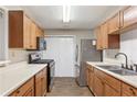 Well-equipped kitchen with stainless steel appliances and ample cabinet space for storage at 1362 Brockett Pl, Clarkston, GA 30021