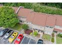 An aerial view shows well-maintained townhome exteriors with ample parking at 1810 Ashborough Se Rd # G, Marietta, GA 30067