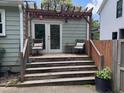 Inviting back deck with pergola, seating, and door to the house at 2002 Shalimar Ne Dr, Atlanta, GA 30345