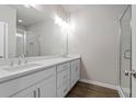Modern bathroom with double vanity, sleek fixtures, glass enclosed shower, and tile surround at 50 Black Gum Lot 49 Ln, Auburn, GA 30011