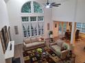 Bright living room featuring tall windows, hardwood floors, and comfortable seating at 522 Blue Mountain, Canton, GA 30114