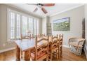 Elegant dining room with hardwood floors and natural light at 3502 Village Green Dr, Roswell, GA 30075
