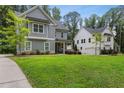 Beautiful home showcasing the manicured lawn and exterior, blending architectural styles at 2362 Browns Mill Rd, Atlanta, GA 30315