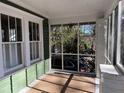 Inviting screened porch with neutral rug, offering a tranquil outdoor living space at 284 Lakeview Ne Ave, Atlanta, GA 30305