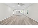 Open-concept living space with wood floors, recessed lighting, and kitchen island at 156 Club Cir, Stockbridge, GA 30281