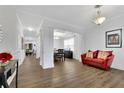 Bright living room featuring hardwood floors, coffered ceiling, and neutral paint at 425 Eldridge Dr, Suwanee, GA 30024