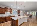 Spacious open kitchen features stainless appliances, granite counters and flows to the cozy living room at 4322 Braden Nw Ln, Kennesaw, GA 30144