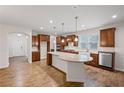 Open kitchen with stainless steel appliances, granite countertops, a large island, and hardwood floors at 4322 Braden Nw Ln, Kennesaw, GA 30144