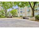 Exterior view of building with mature trees and nicely landscaped entrance at 244 13Th Ne St # 302, Atlanta, GA 30309
