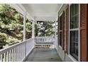 Inviting porch featuring a comfortable porch swing and outdoor views at 98 Little John Way, Douglasville, GA 30134