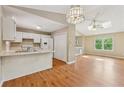 Bright, open kitchen with white cabinetry, modern appliances, and a spacious breakfast area at 3450 Saddleton Way, Douglasville, GA 30134