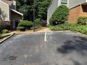 Paved parking area of townhome with landscaping at 40 Dunwoody Springs Dr, Atlanta, GA 30328