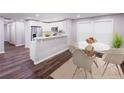 Bright eat-in kitchen with stainless appliances, and bar top at 6494 Bimini Dr, Forest Park, GA 30297
