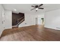 Open-concept living room with new floors and a staircase to upper level at 2780 Northwood Court Sw Ct, Marietta, GA 30060