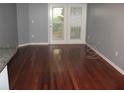 Spacious living room with hardwood floors, a balcony, and neutral paint at 10 Perimeter Summit Ne Blvd # 3105, Atlanta, GA 30319