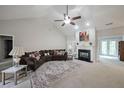 Bright living room with a fireplace, large sectional sofa, and French doors at 450 Hunt Creek Dr, Acworth, GA 30101