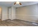 Bright living room boasts wood-look flooring and neutral paint, ready for your personal touch at 5026 Brittany Dr, Stone Mountain, GA 30083