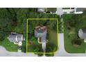 Aerial view of property and its boundaries surrounded by lush green trees and a cul-de-sac at 1248 Rockview Ct, Loganville, GA 30052