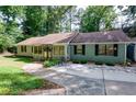 Charming single-story home featuring a cozy front patio and well-maintained landscaping at 2639 Hummingbird Nw Dr, Duluth, GA 30096