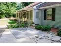 Inviting patio with stylish outdoor furniture and well-maintained landscaping at 2639 Hummingbird Nw Dr, Duluth, GA 30096