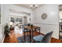 Bright dining room adjacent to living room features hardwood floors and modern lighting at 425 Lindbergh Ne Dr # A2, Atlanta, GA 30305