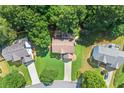 Aerial shot of a well-maintained home with lush greenery and a long driveway at 7505 Brookwood Way, Cumming, GA 30041