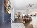 Inviting living room featuring hardwood floors, a ceiling fan and an open floor plan at 1802 Lexington Green Pnes, Cumming, GA 30040