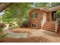 Brick home featuring an inviting entrance with brick steps and well-kept landscaping at 1693 Alderbrook Ne Rd, Atlanta, GA 30345