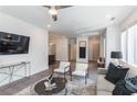 The open living room offers views of the kitchen, ceiling fan, furniture, and decor at 371 Grant Cir # 1813, Atlanta, GA 30315