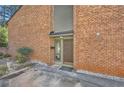 Inviting brick exterior with a well-lit front door and tidy landscaping at 2459 Cedar Canyon Se Ct, Marietta, GA 30067