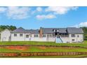 Spacious backyard with new gray roofing, an outdoor patio and an outdoor dining area at 1169 Hodges Cir, Mansfield, GA 30055