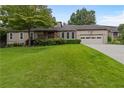 Charming home with a well-manicured lawn and mature trees at 3711 Frey Lake Nw Rd, Kennesaw, GA 30144