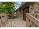 Inviting porch with stone accents and a wood railing at 3711 Frey Lake Nw Rd, Kennesaw, GA 30144