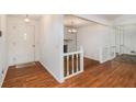 Inviting foyer with hardwood floors, a white fireplace, and entry to the main level at 60 Ivy Dr, Covington, GA 30016
