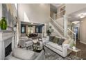 Inviting living room with fireplace, staircase, and seamless flow to dining area at 2102 Berryhill Se Cir, Smyrna, GA 30082